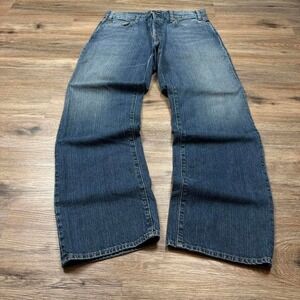 beautifully worn and distressed vintage 90s button fly gap denim jeans